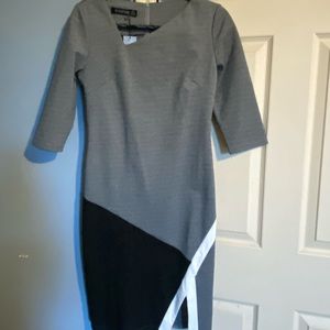 Asymmetric dress with 3/4 length sleeves.  Never worn.